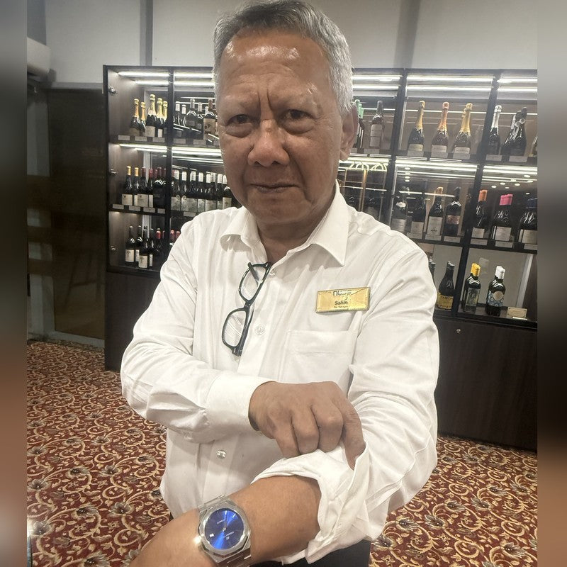 Andrina Yvette client Salim wearing his Legacy Collection Sunburst Blue timepiece
